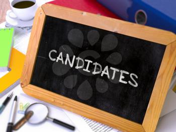 Candidates - Chalkboard with Hand Drawn Text, Stack of Office Folders, Stationery, Reports on Blurred Background. Toned Image. 3D Render.