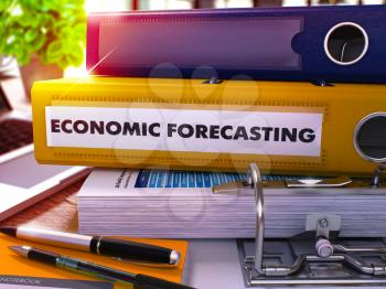 Yellow Ring Binder with Inscription Economic Forecasting on Background of Working Table with Office Supplies and Laptop. Economic Forecasting Business Concept on Blurred Background. 3D Render.