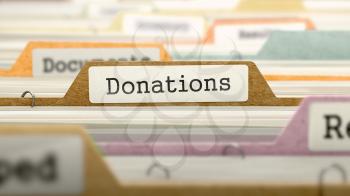 Donations on Business Folder in Multicolor Card Index. Closeup View. Blurred Image. 3D Render.