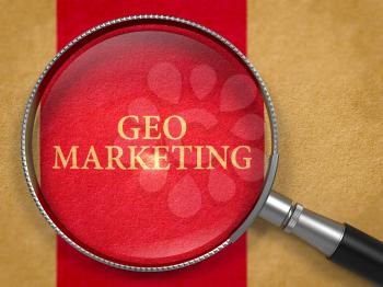 Geo Marketing Concept through Magnifier on Old Paper with Dark Red Vertical Line Background. 3D Render.