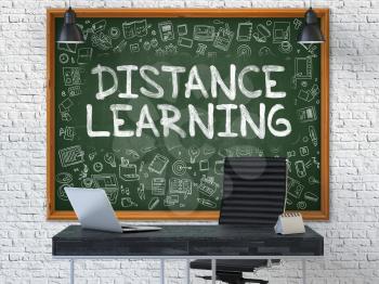 Distance Learning - Handwritten Inscription by Chalk on Green Chalkboard with Doodle Icons Around. Business Concept in the Interior of a Modern Office on the White Brick Wall Background. 3D.