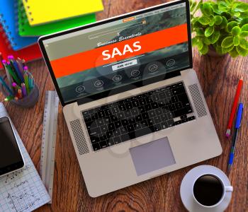SaaS - Software as a Service - on Laptop Screen. E-Business Concept.