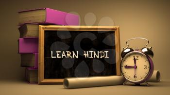 Hand Drawn Learn Hindi Concept  on Chalkboard. Blurred Background. Toned Image. 3D Render.
