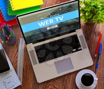 Web TV Concept. Modern Laptop and Different Office Supply on Wooden Desktop Background. 3D Render.