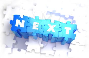 Next - Text on Blue Puzzles on White Background. 3D Render. 