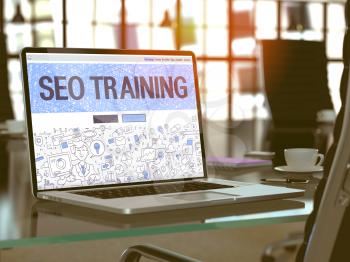 SEO Training Concept. Closeup Landing Page on Laptop Screen in Doodle Design Style. On Background of Comfortable Working Place in Modern Office. Blurred, Toned Image. 3D Render.
