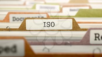 File Folder Labeled as ISO - International Organization Standardization - in Multicolor Archive. Closeup View. Blurred Image. 3D Render.