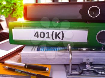 401K - Green Office Folder on Background of Working Table with Stationery and Laptop. 401K Business Concept on Blurred Background. 401K Toned Image. 3D.