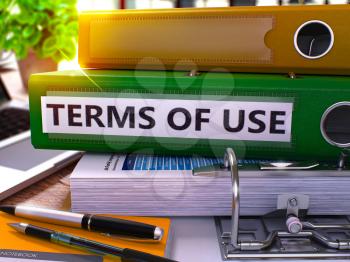 Terms of Use - Green Office Folder on Background of Working Table with Stationery and Laptop. Terms of Use Business Concept on Blurred Background. Terms of Use Toned Image. 3D.