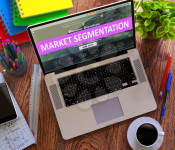 Market Segmentation Concept. Modern Laptop and Different Office Supply on Wooden Desktop background. 3D Render.