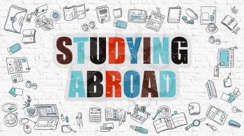 Studying Abroad Concept. Studying Abroad Drawn on White Wall. Studying Abroad in Multicolor. Doodle Design. Modern Style Illustration. Line Style Illustration. White Brick Wall.