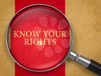 Know Your Rights through Loupe on Old Paper with Dark Red Vertical Line Background. 3D Render.