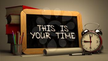 This is Your Time Handwritten on Chalkboard. Time Concept. Composition with Chalkboard and Stack of Books, Alarm Clock and Scrolls on Blurred Background. Toned Image. 3D Render.
