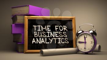 Time for Business Analytics Handwritten by white Chalk on a Blackboard. Composition with Small Chalkboard and Stack of Books, Alarm Clock and Rolls of Paper on Blurred, Toned Image. 3D Render.