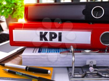 Red Ring Binder with Inscription KPI - Key Performance Indicator - on Blurred Background of Working Table with Office Supplies and Laptop. KPI - Toned Illustration. 3D Render.