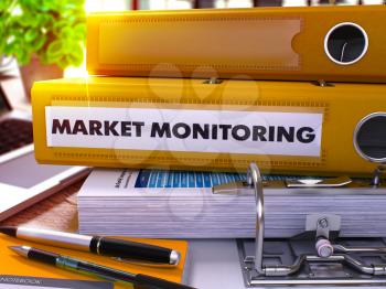 Market Monitoring - Yellow Office Folder on Background of Working Table with Stationery and Laptop. Market Monitoring Business Concept on Blurred Background. Market Monitoring Toned Image. 3D.