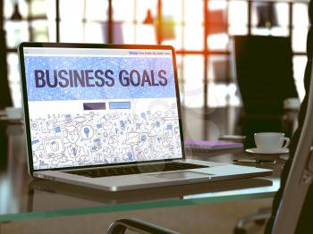 Business Goals - Closeup Landing Page in Doodle Design Style on Laptop Screen. On Background of Comfortable Working Place in Modern Office. Toned, Blurred Image. 3D Render.