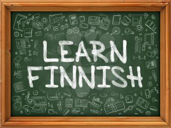 Learn Finnish - Handwritten Inscription by Chalk on Green Chalkboard with Doodle Icons Around. Modern Style with Doodle Design Icons. Learn Finnish on Background of Green Chalkboard with Wood Border.