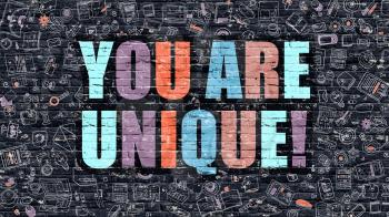 You are Unique. Multicolor Inscription on Dark Brick Wall with Doodle Icons. You are Unique Concept in Modern Style. Doodle Design Icons. You are Unique on Dark Brickwall Background.