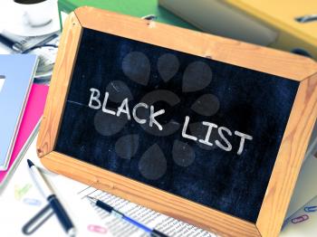 Black List Concept Hand Drawn on Chalkboard on Working Table Background. Blurred Background. Toned Image. 3D Render.