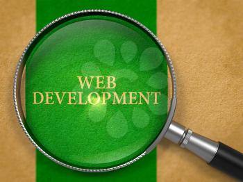 Web Development through Magnifying Glass on Old Paper with Green Vertical Line Background. 3D Render.