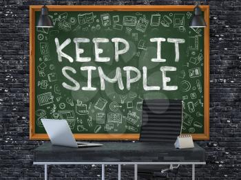 Keep it Simple Concept Handwritten on Green Chalkboard with Doodle Icons. Office Interior with Modern Workplace. Dark Brick Wall Background. 3D.