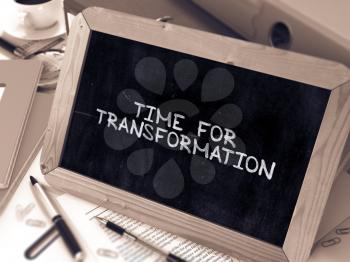 Time for Transformation Concept Hand Drawn on Chalkboard on Working Table Background. Blurred Background. Toned Image. 3D Render.