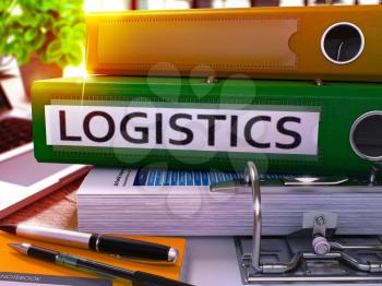 Green Office Folder with Inscription Logistics on Office Desktop with Office Supplies and Modern Laptop. Logistics Business Concept on Blurred Background. Logistics - Toned Image. 3D.