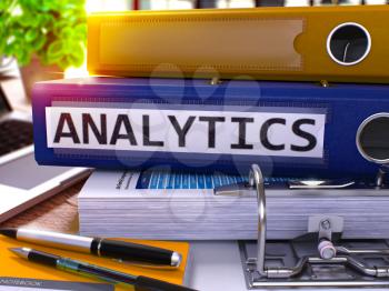 Analytics - Blue Ring Binder on Office Desktop with Office Supplies and Modern Laptop. Analytics Business Concept on Blurred Background. Analytics - Toned Illustration. 3D Render.