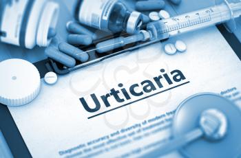 Urticaria - Printed Diagnosis with Blurred Text. Urticaria, Medical Concept with Pills, Injections and Syringe. 3D.