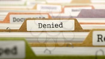 Denied on Business Folder in Multicolor Card Index. Closeup View. Blurred Image. 3D Render.