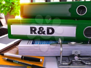 Research and Development - Green Office Folder on Blurred Background of Working Table with Stationery and Laptop. Business Concept. Research and Development on Toned Image. 3D.