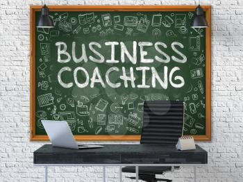 Business Coaching - Handwritten Inscription by Chalk on Green Chalkboard with Doodle Icons Around. Business Concept in the Interior of a Modern Office on the White Brick Wall Background. 3D.