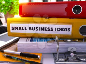 Small Business Ideas - Yellow Office Folder on Background of Working Table with Stationery and Laptop. Small Business Ideas Business Concept on Blurred Background. 3D.