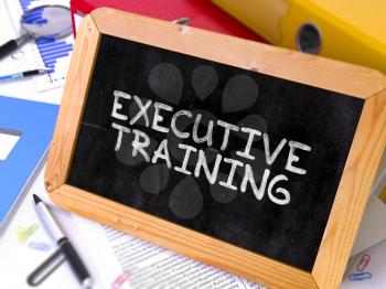 Executive Training Concept Hand Drawn on Chalkboard on Working Table Background. Blurred Background. Toned Image. 3D Render.