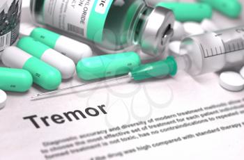 Tremor - Printed with Blurred Text. On Background of Medicaments Composition - Mint Green Pills, Injections and Syringe. 3D Render.