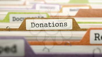 Donations Concept on Folder Register in Multicolor Card Index. Closeup View. Selective Focus. 3D Render.