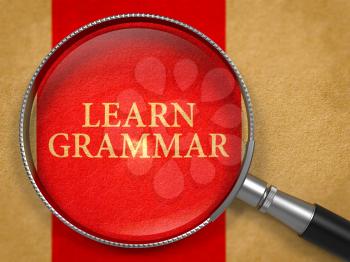 Learn Grammar Concept through Magnifier on Old Paper with Red Vertical Line Background. 3D Render.