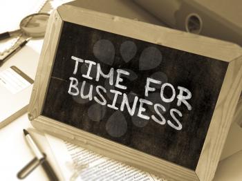 Handwritten Time for Business on a Chalkboard. Composition with Chalkboard and Ring Binders, Office Supplies, Reports on Blurred Background. Toned Image. 3D Render.