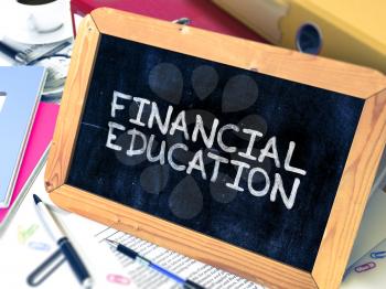Financial Education Concept Hand Drawn on Chalkboard on Working Table Background. Blurred Background. Toned Image. 3D Render.
