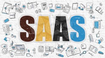 SaaS - Software as a Service. Multicolor Inscription on White Brick Wall with Doodle Icons Around. SaaS - Software as a Service - Concept. Modern Style Illustration with Doodle Design Icons. 
