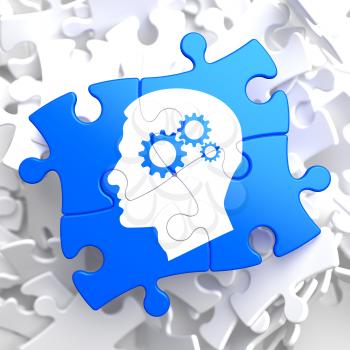 Psychological Concept - Profile of Head with Cogwheel Gear Mechanism Located on Blue Puzzle.