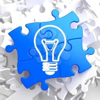 Light Bulb Icon on Blue Puzzle. Idea Concept.