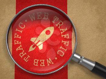 Magnifying Glass with Web Traffic Written Arround Icon of Go Up Rocket on Old Paper with Red Vertical Line Background. Internet Concept.