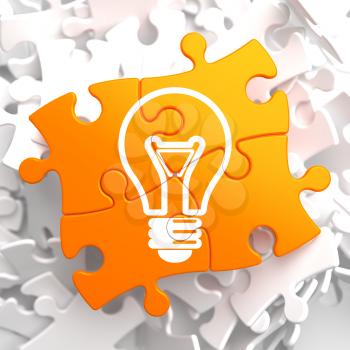 Light Bulb Icon on Orange Puzzle. Idea Concept.