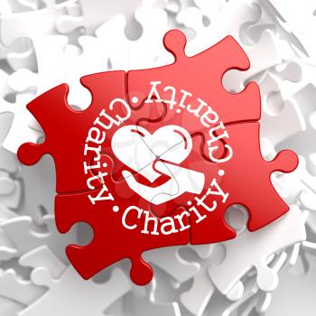 Charity Word Written Arround Icon of Heart in the Hand, Located on Red Puzzle. Social Concept.