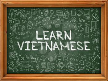 Learn Vietnamese - Hand Drawn on Green Chalkboard with Doodle Icons Around. Modern Illustration with Doodle Design Style.