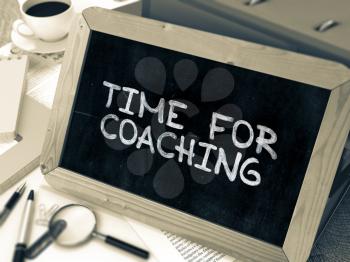 Handwritten Time for Coaching on a Chalkboard. Composition with Chalkboard and Ring Binders, Office Supplies, Reports on Blurred Background. Toned Image. 3D Render.