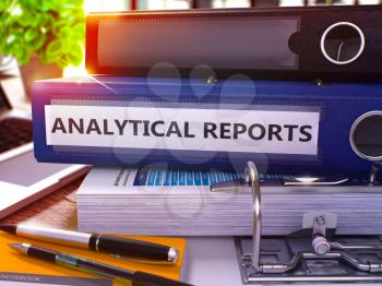 Analytical Reports - Blue Office Folder on Background of Working Table with Stationery and Laptop. Analytical Reports Business Concept on Blurred Background. Analytical Reports Toned Image. 3D Render.