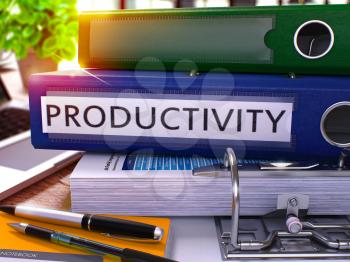 Blue Office Folder with Inscription Productivity on Office Desktop with Office Supplies and Modern Laptop. Productivity Business Concept on Blurred Background. Productivity - Toned Image. 3D.